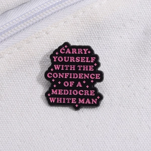 Black enamel brooch with pink funny letter art and stars on white canvas background