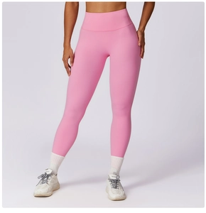 Detail of high-waist seamless waistband on pink yoga pants for tummy control