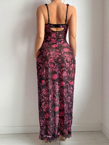 Detail of adjustable straps and back cutout on a floral sheer mesh slip dress