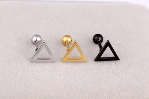 Detailed trio of silver, gold, and black triangle earrings with screw backs on velvet