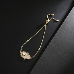 Detail of Hamsa Hand bracelet with colorful zircons and adjustable gold chain