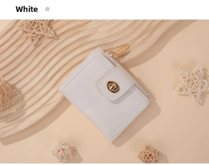 Close-up of white women's wallet with golden twist lock and secure side zipper
