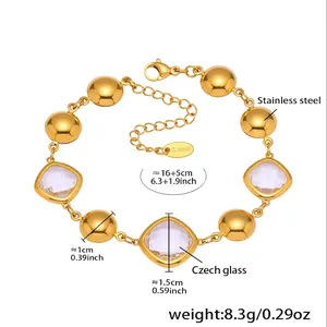 Detailed view of faceted Czech glass beads and S.steel tag on gold bracelet
