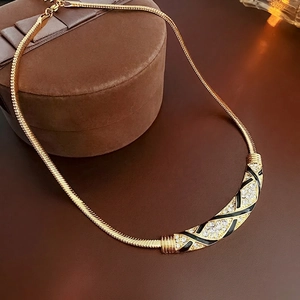 Vintage Schlangenkette in Gold mit schwarzer Emaille und funkelnden Kristallen