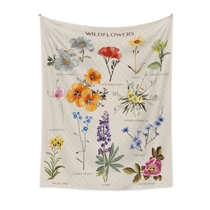 Detailed view of bohemian wildflower tapestry with floral illustrations and plant names
