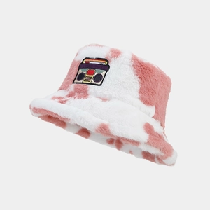 Detailed view of plush pink marble faux fur bucket hat with retro radio cassette patch