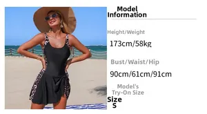 Detail view of one-piece skirt swimsuit with leopard print panels and beach styling