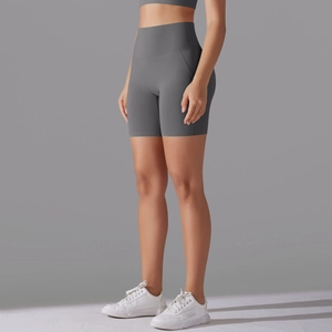 Close-up of high-waist grey yoga shorts showing smooth seamless compression fabric