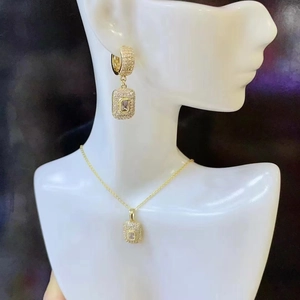 Elegant gold square geometric jewelry set with pavé cubic zirconia on necklace and earrings