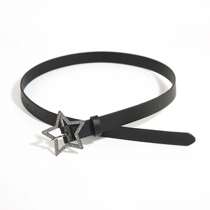 Close-up of black Y2K belt featuring a sparkling rhinestone star-shaped buckle