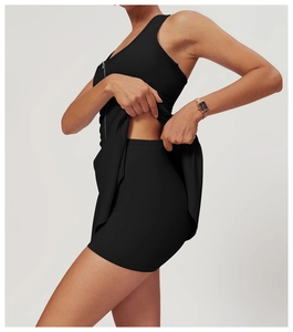 Detail of black sports dress featuring a front zipper and built-in safety shorts