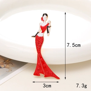 Detail showing 7.5cm red resin dress girl charm with ruby rhinestones and weight info