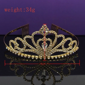 Detail view of gold rhinestone tiara with 13cm width and 3.5cm height measurements