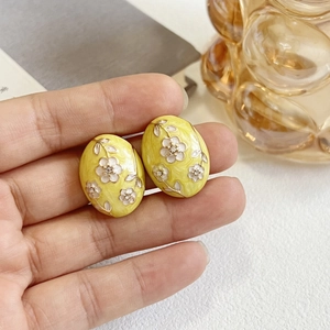Vintage oval enamel stud earrings with white flower patterns and 925 silver pins