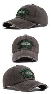 Macro shot of retro washed baseball cap featuring vintage embroidery and distressed details