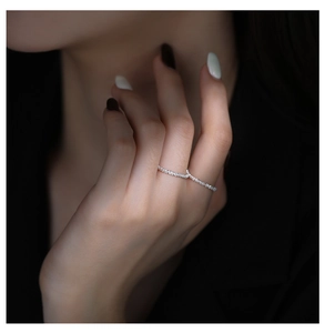 Close-up of sparkling S925 sterling silver rings with micro-set zircons on hand