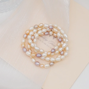 Detailed view of multi-strand freshwater pearl bracelet with natural luster and textures