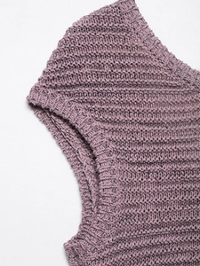 Detailed close-up of purple knit sweater showing intricate hollow crochet texture and cuffs