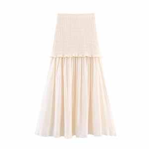Detailed close-up of high-waist patchwork dress featuring knit top and chiffon pleated skirt