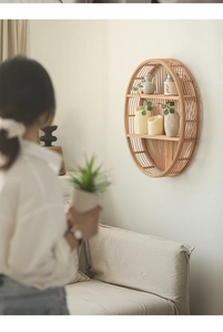 Close-up of natural bamboo woven wall shelf with two-tier storage for minimalist home decor