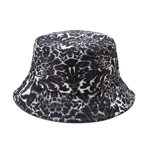 Foldable black and white leopard print bucket hat with wide brim and stitched details