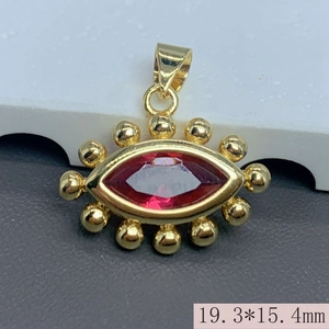 Detailed close-up of a gold-plated evil eye pendant with a red zircon stone and size data