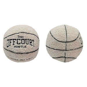 Plush basketball pillow in beige boucle fabric with embroidered OFF COURT HUSTLE text