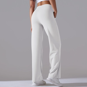 Rear view of high waist white wide leg sports pants with side pockets for yoga and fitness