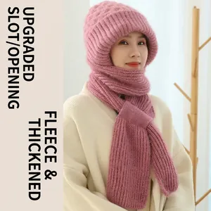 Detailed view of the pink knitted winter hood showing soft fleece lining and buckled scarf