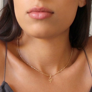 Elegant gold plated stainless steel initial G necklace with a small heart pendant for women