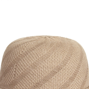 Close-up of the woven texture on the crown of this beige summer straw sun hat