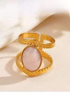 Detail of pink oval stone ring with 18K gold plated double-layer hollow band and beads