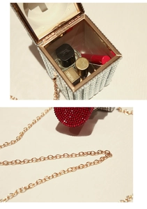 Detail of silver rhinestone evening bag with gold chain strap and compact interior