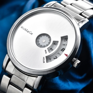 Macro shot of silver metal watch dial with rotating time disks on blue silk fabric