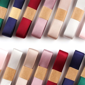 Multiple rolls of 1.5cm double-sided satin ribbons in assorted colors for gift wrapping