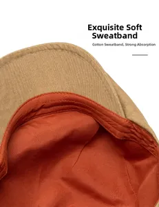 Detail of soft cotton sweatband in orange with durable double stitching on khaki beret
