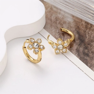 Detailed view of 18k gold plated flower earrings with five sparkling crystals