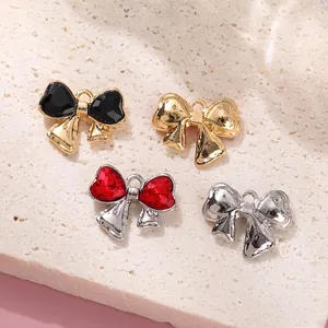 Bow-shaped alloy pendants with heart gemstones in four color finishes for DIY jewelry