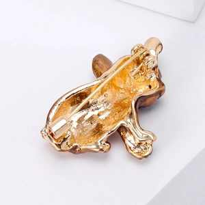 Minimalist golden alloy pug dog brooch with brown enamel finish shown from the back view