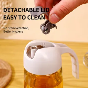 Bouteille d'huile 630ml en verre anti-fuite avec couvercle automatique sur bois