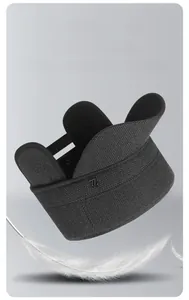 Detail of warm winter flat cap showing wool texture and heat storage metal logo