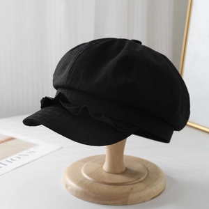 Chic black linen newsboy cap with elegant ruffle trim and breathable plaid fabric