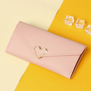 Close-up of pink PU leather long wallet with a gold heart-shaped metal lock and envelope flap