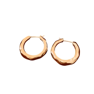 Elegant gold plated hammered hoop earrings with irregular lava texture for women