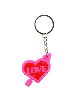 Detail of red and pink PVC heart keychain with Cupid arrow and metallic keyring