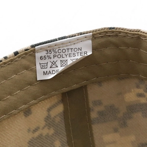 Detail view of cotton-polyester camouflage cap showing sweatband and care label