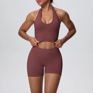 Detail of burgundy ribbed seamless yoga set showing racerback sports bra and high waist shorts