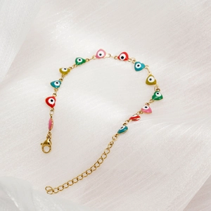 Gold stainless steel bracelet with multi-colored enamel heart-shaped evil eye charms