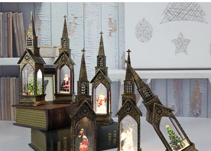 Close-up of vintage bronze Christmas lanterns with festive scenes and LED lights