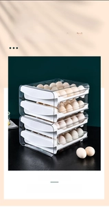 Close-up of a 4-tier stackable transparent drawer-style plastic egg storage container